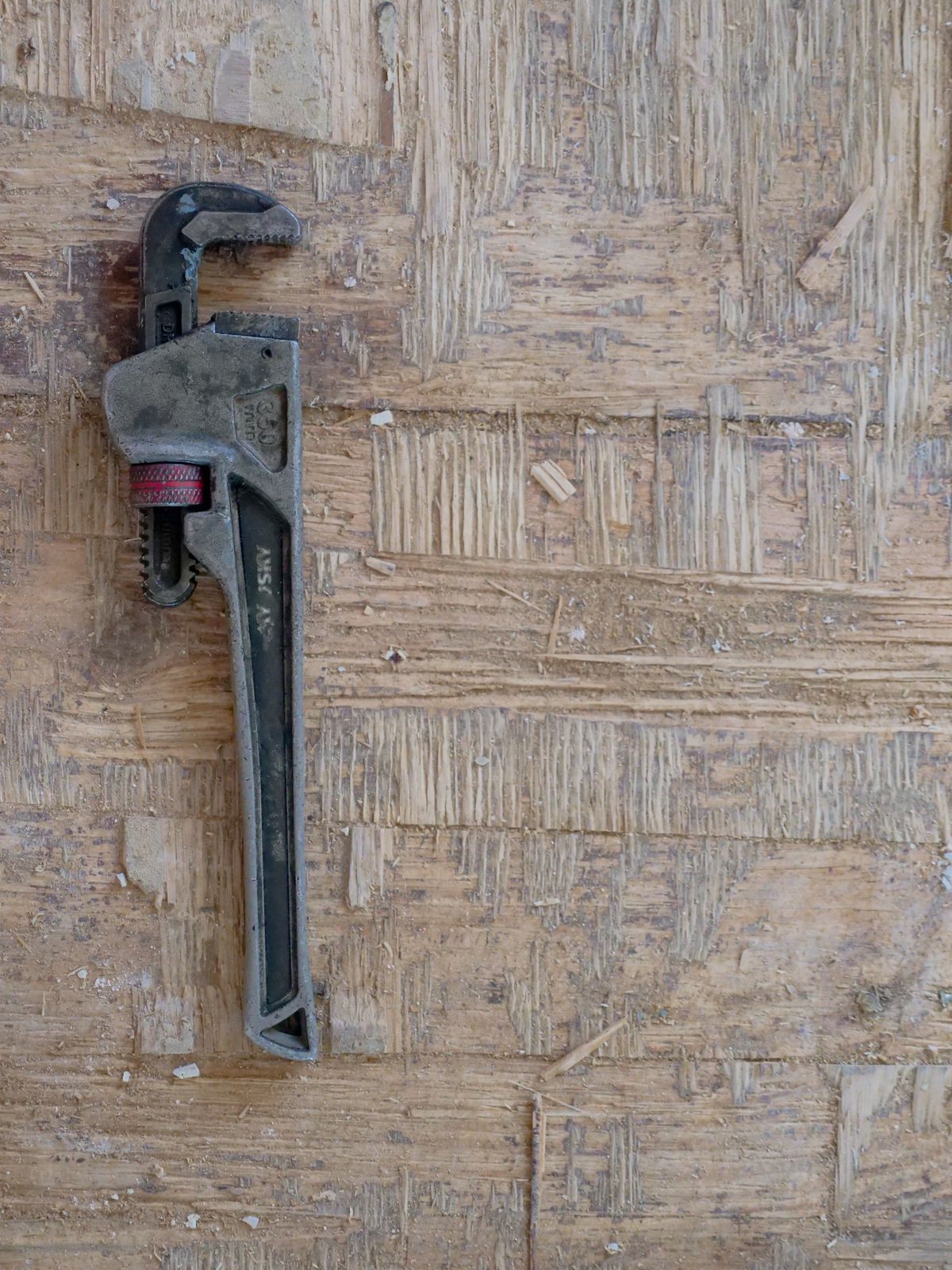 Emergency plumber costs A plumber's pipe wrench